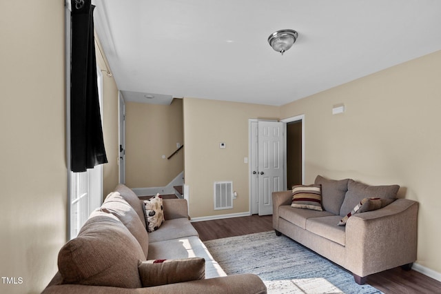 living room with dark wood-type flooring