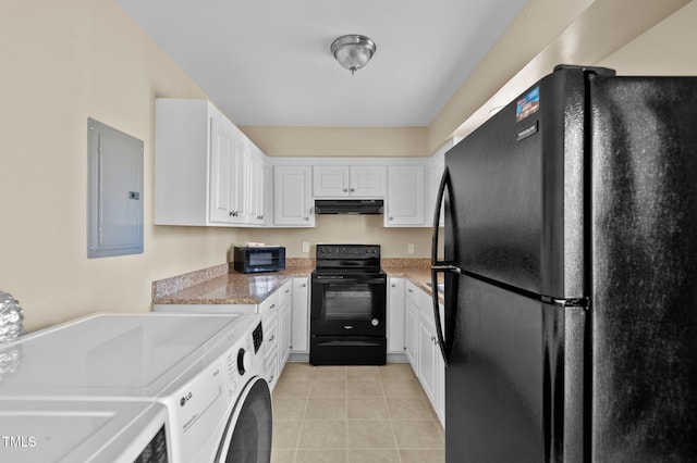 kitchen featuring washer / dryer, black appliances, light tile patterned floors, electric panel, and white cabinets