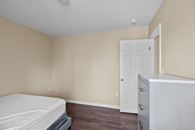 bedroom featuring dark hardwood / wood-style floors