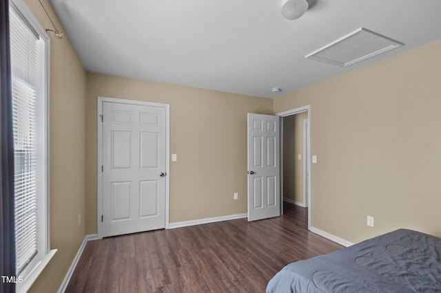 bedroom featuring dark hardwood / wood-style flooring