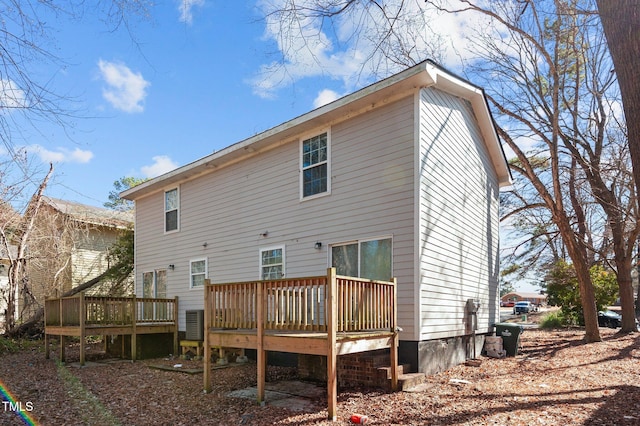 back of house with a deck