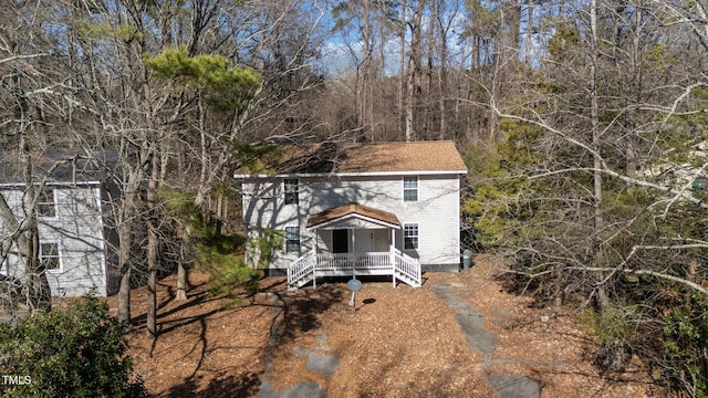 view of front facade with a wooden deck