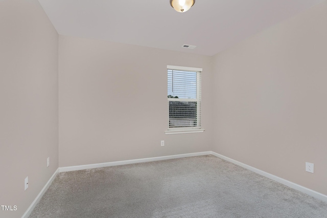 empty room with baseboards and carpet floors