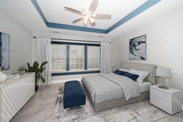 520 Camden Yards Way, Cary, NC 27519 - carpeted bedroom with a tray ceiling and ceiling fan
