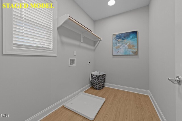 607 Marshskip Way, Rolesville, NC 27571 - laundry area featuring hookup for an electric dryer, light wood finished floors, hookup for a washing machine, and baseboards