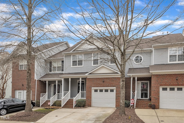 view of property with brick siding and concrete driveway