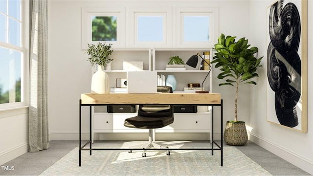 office space with light colored carpet and plenty of natural light