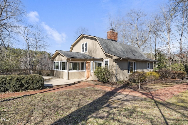 rear view of property with a patio area