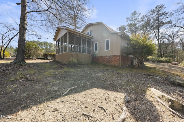 exterior space featuring a sunroom