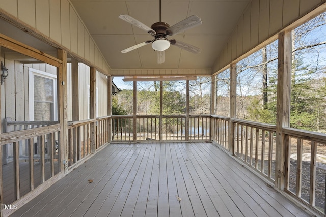 unfurnished sunroom featuring ceiling fan and lofted ceiling