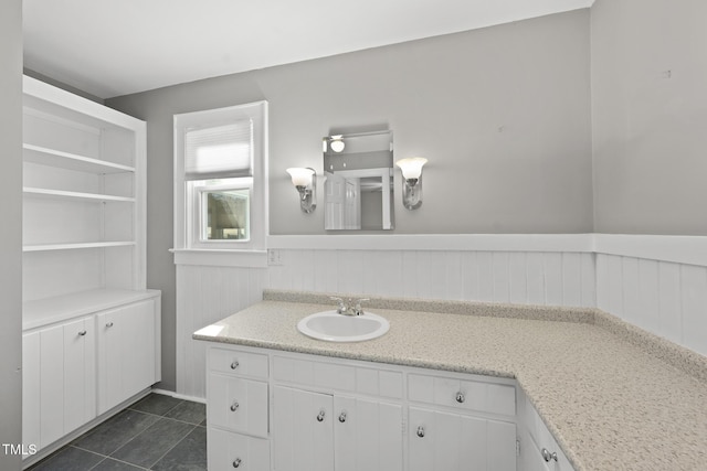 bathroom featuring tile patterned flooring and vanity