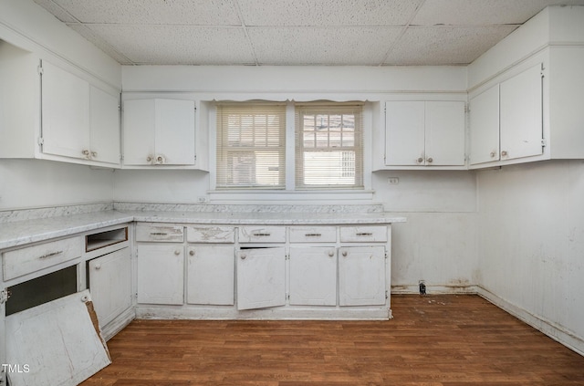 kitchen featuring dark hardwood / wood-style floors and white cabinets