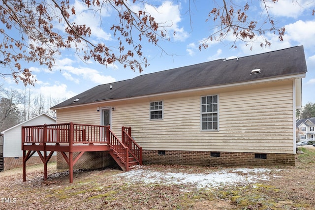 back of house featuring a deck