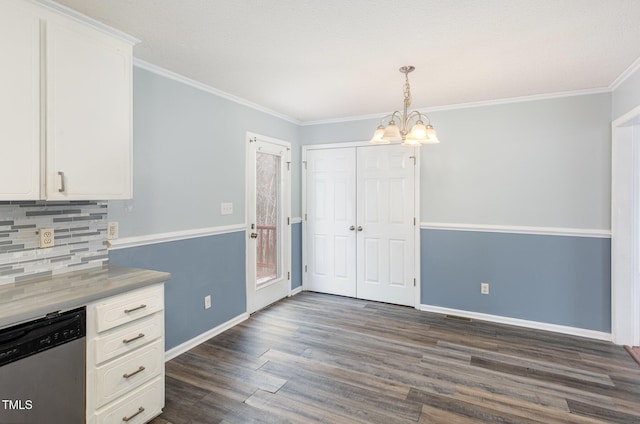 kitchen with dark wood-type flooring, white cabinetry, crown molding, a chandelier, and stainless steel dishwasher