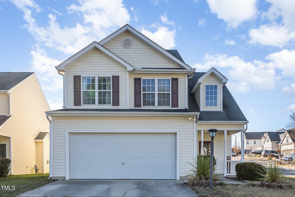 front facade with a garage