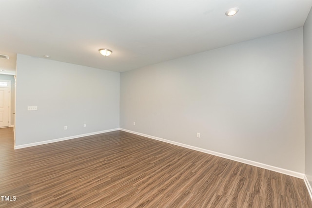 empty room featuring dark hardwood / wood-style floors