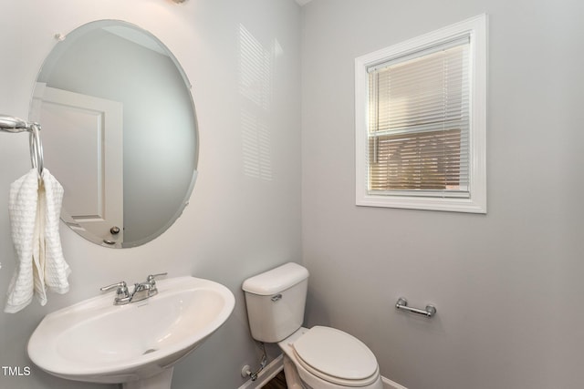 bathroom with sink and toilet