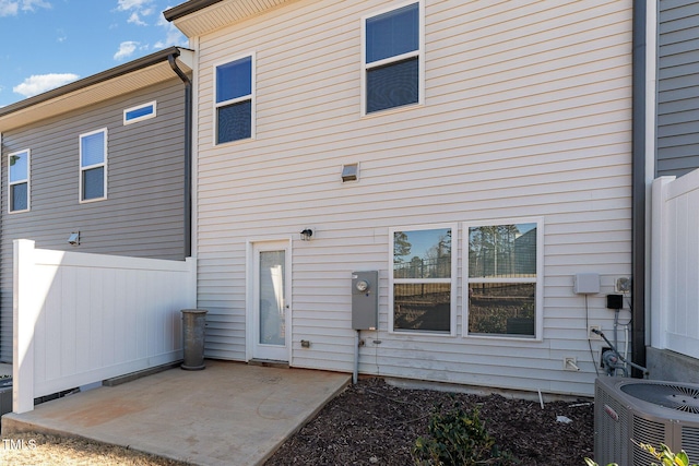 back of house with central AC unit and a patio area