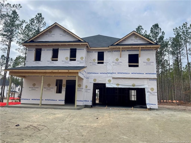 unfinished property with a garage