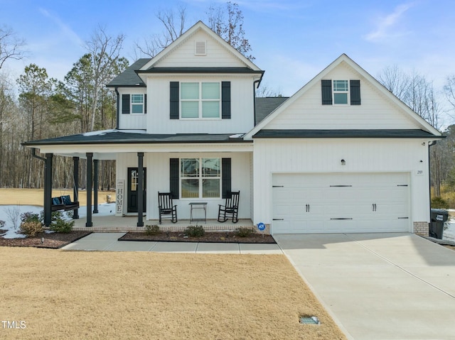 view of front of house with a garage and a porch