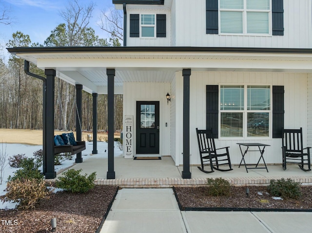 entrance to property featuring covered porch