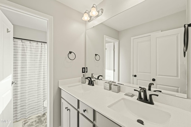 bathroom featuring vanity and a shower with shower curtain