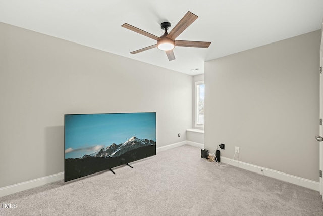 interior space featuring ceiling fan and light carpet