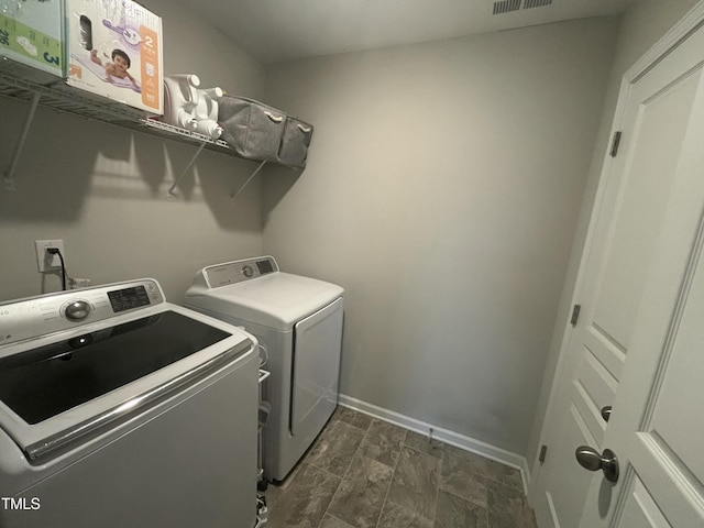 laundry area featuring independent washer and dryer