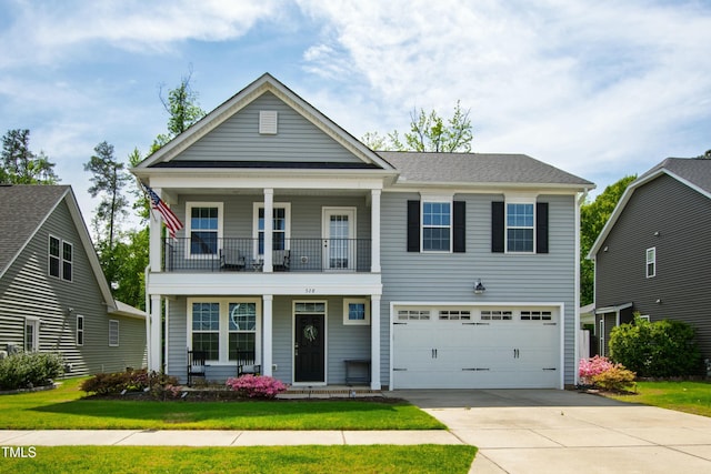view of front facade with a porch, a front yard, a garage, a balcony, and concrete driveway