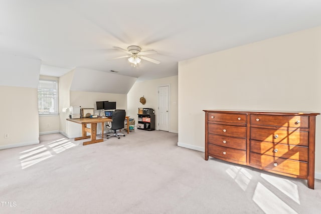 home office featuring visible vents, a ceiling fan, carpet, baseboards, and vaulted ceiling