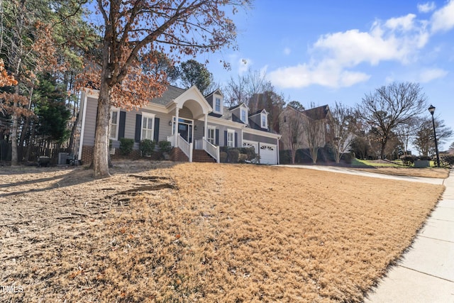 view of front of property with a porch and an attached garage