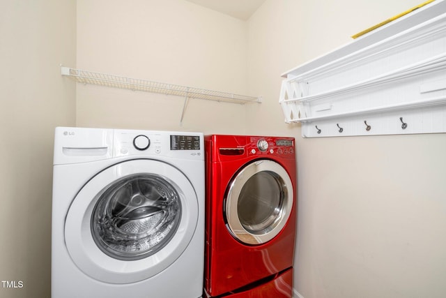 washroom featuring laundry area and washer and dryer