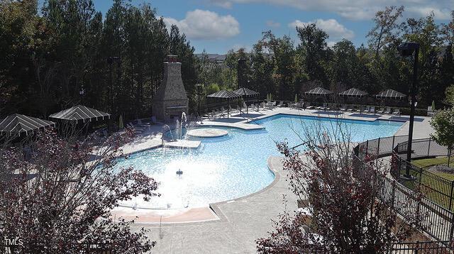 pool with a patio, a gazebo, and fence