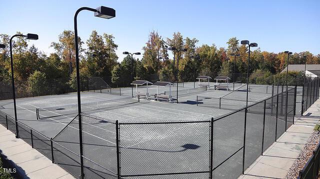 view of tennis court with fence