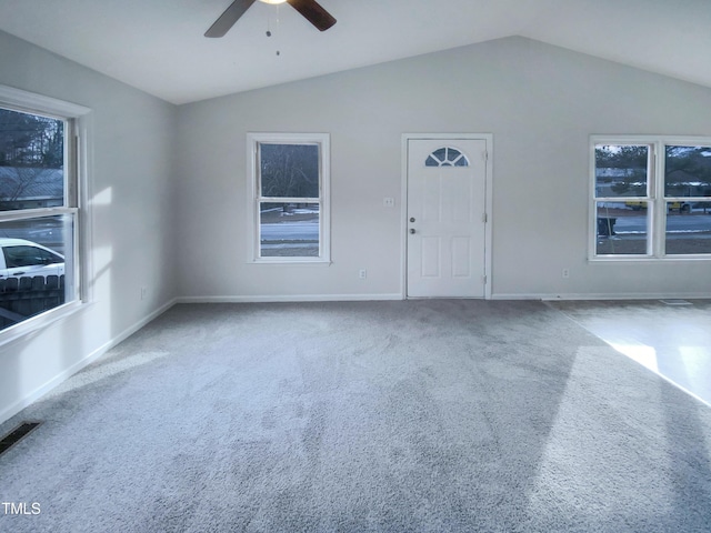 carpeted empty room with lofted ceiling and ceiling fan