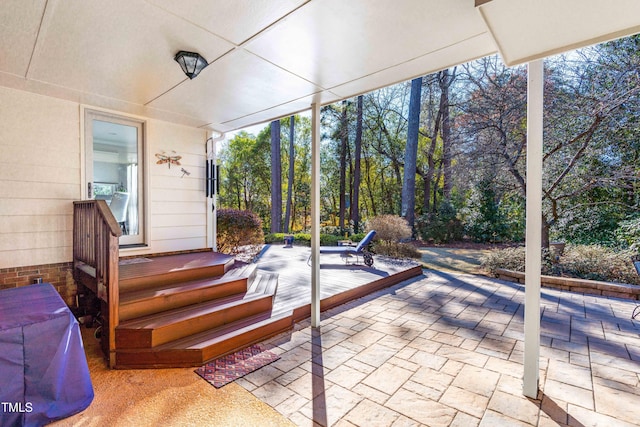 unfurnished sunroom with a wealth of natural light