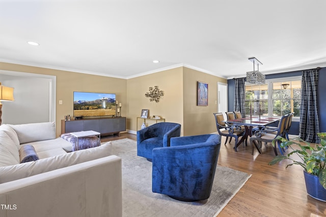 living room featuring crown molding and hardwood / wood-style flooring