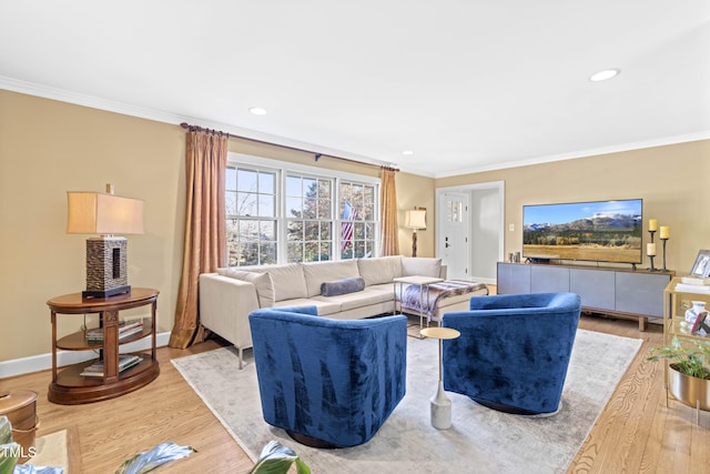 living room with ornamental molding and hardwood / wood-style floors