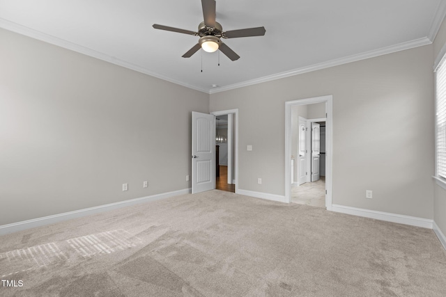 unfurnished bedroom with crown molding, light colored carpet, and ceiling fan