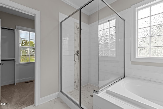 bathroom featuring ornamental molding and plus walk in shower