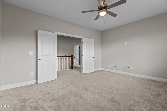 empty room with light carpet and ceiling fan