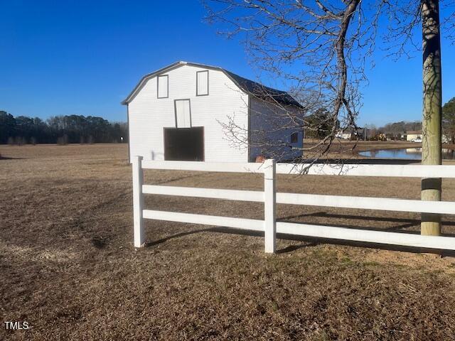 view of outbuilding with a water view