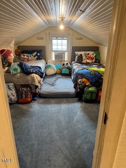 carpeted bedroom featuring vaulted ceiling