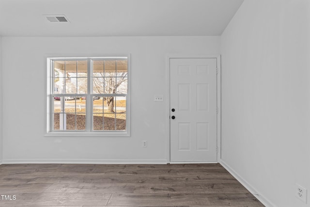 empty room featuring dark wood-type flooring