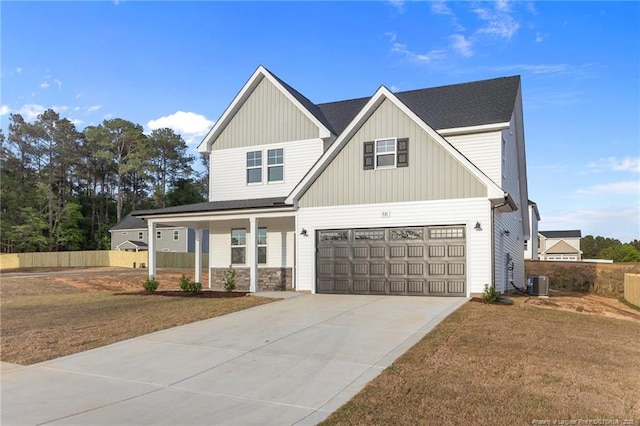 531 Southerland Peak, Raeford, NC 28376 - view of front facade with driveway, fence, a garage, and covered porch