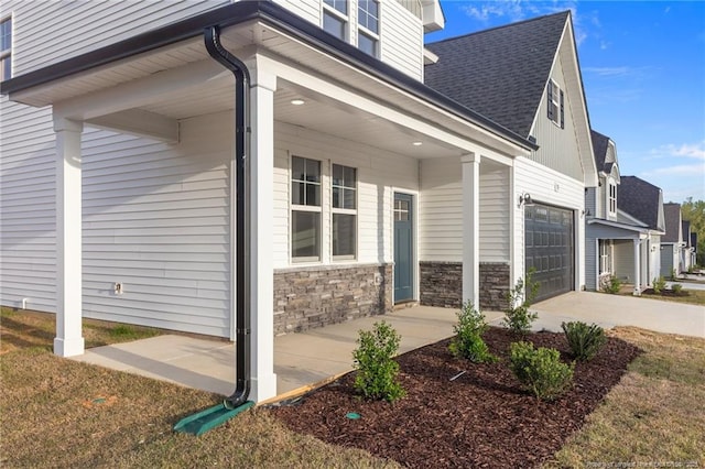 531 Southerland Peak, Raeford, NC 28376 - view of home's exterior featuring stone siding, a shingled roof, and concrete driveway