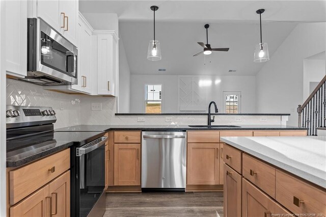 531 Southerland Peak, Raeford, NC 28376 - kitchen featuring a ceiling fan, a sink, backsplash, lofted ceiling, and appliances with stainless steel finishes