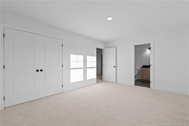 531 Southerland Peak, Raeford, NC 28376 - unfurnished bedroom with baseboards, recessed lighting, carpet, a closet, and ensuite bath