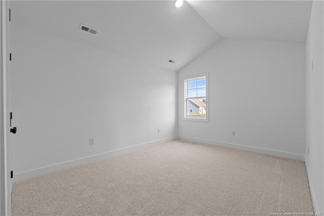 531 Southerland Peak, Raeford, NC 28376 - spare room with baseboards, vaulted ceiling, visible vents, and light colored carpet