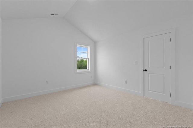 531 Southerland Peak, Raeford, NC 28376 - empty room with lofted ceiling, visible vents, carpet floors, and baseboards